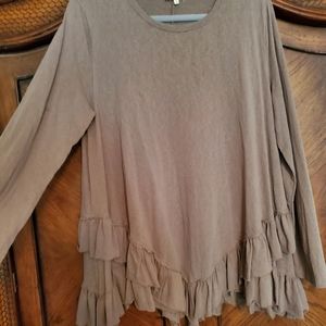 Long sleeved ruffled top.